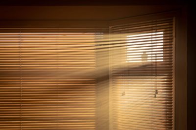sun streaming through Venetian blinds