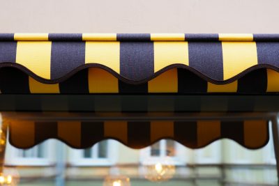 Awning - Yellow and black awning decor in front of a shop