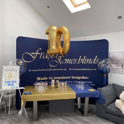 10th Anniversary of Fraser James Blinds celebration with display and '10' balloon